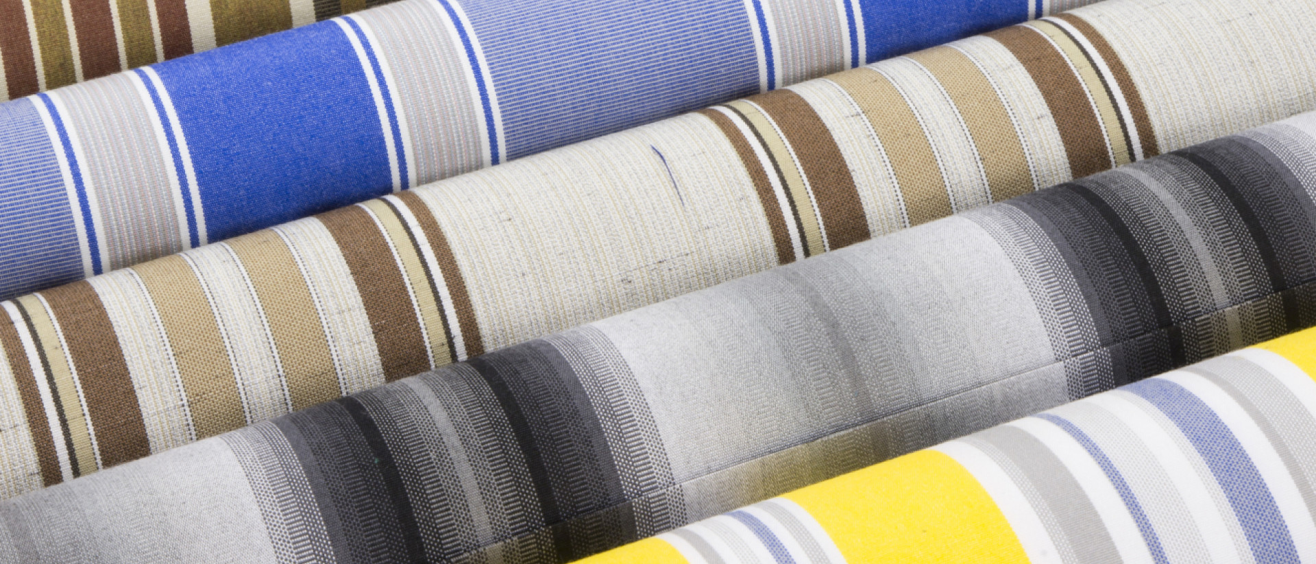 Stripe patterned fabrics rolled up